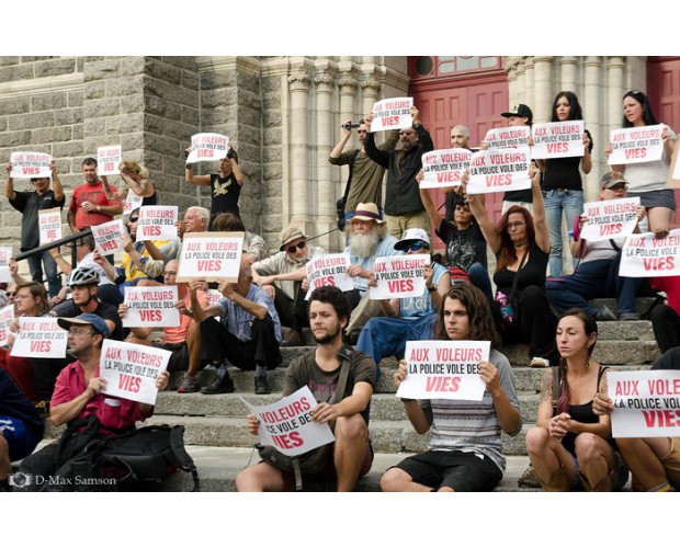 Rally October 22 in Québec, Canada – Signs say “THIEVES! Police Steal Lives” Photo: D-Max Samson
