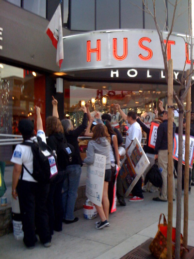 People flipping off Hustler in Los Angeles