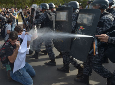 In Brasília, the capital city of Brazil, police shot pepper spray and tear gas to stop protesters from reaching Congress. In Rio de Janeiro, the police attacked protesters with tear gas and rubber bullets. Dozens were reported injured.