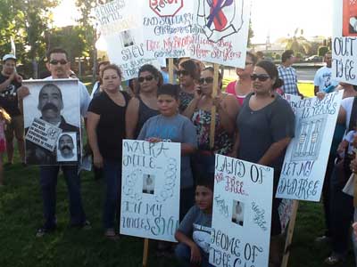 People with family members who are in SHU isolation prison units protest in front of the city hall in Norwalk, California, July 8