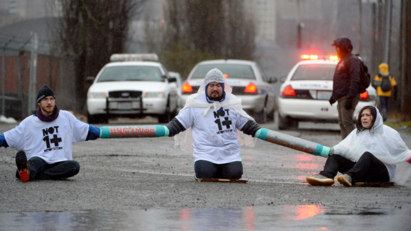 Blocking the road in front of the federal Northwest Detention Center, Tacoma, Washington, February 2014. AP photo