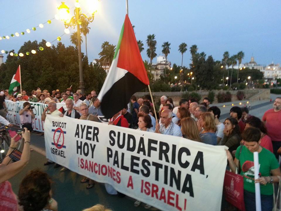 July 24, Seville, Andalusia (Spain) sign translates to: Yesterday South Africa, Today, Palestine. Sanctions against Israel!