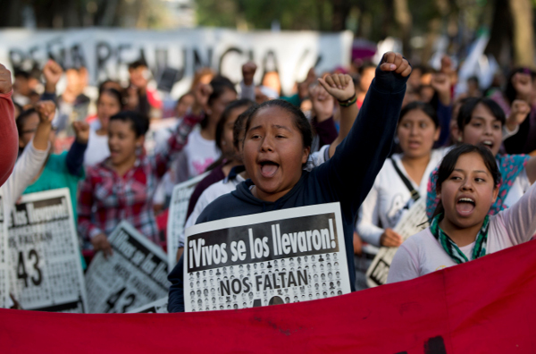 Demonstration in Mexico City in February 2015, with posters saying, "You took them alive, return them alive!"