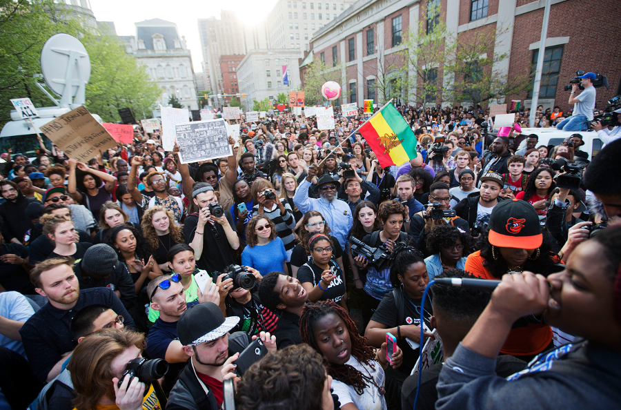 Thousands of students from Johns Hopkins University, Goucher, Towson, and other campuses in Baltimore and nearby rally at the City Hall after marching through the streets, two days after the uprising. April 29.