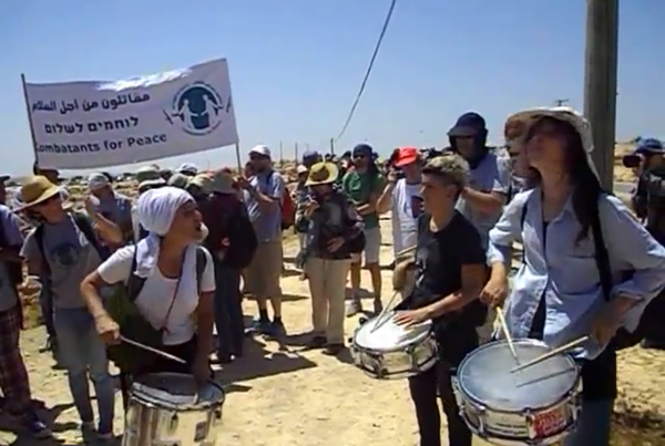 Israeli supporters of the Palestinian villagers in Susiya participate in the demonstration against the threatened Israeli demolition of the village.