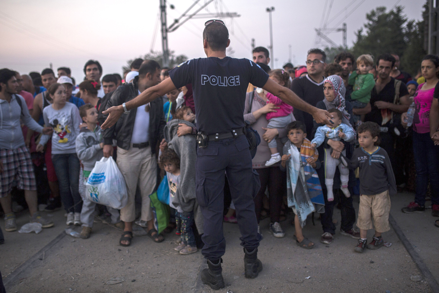 Syrian refugees as they wait to cross the border from Greece to Macedonia.  Aug. 26, 2015.