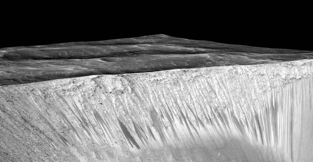 Dark streaks at Garni Crater on Mars, hypothesized to be formed by flow of liquid water