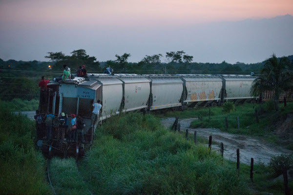 Central American migrants riding "La Bestia," a freight train that had provided a major route across Mexico prior to the crackdown, August 2014. 