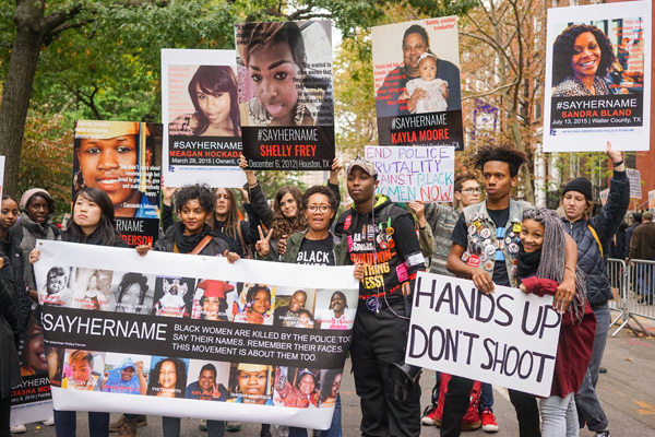 #SAYHERNAME contingent. The #SAYHERAME campaign documents women murdered by police.