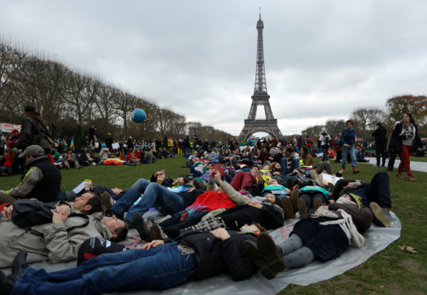 Die-in during protest near the Eiffel Tower, Paris, December 12.