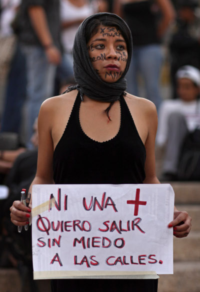 Sign readsL "Not one more, I want to go into the streets without fear, International Women's Day, Mexico City, Mexico, March 8, 2011.