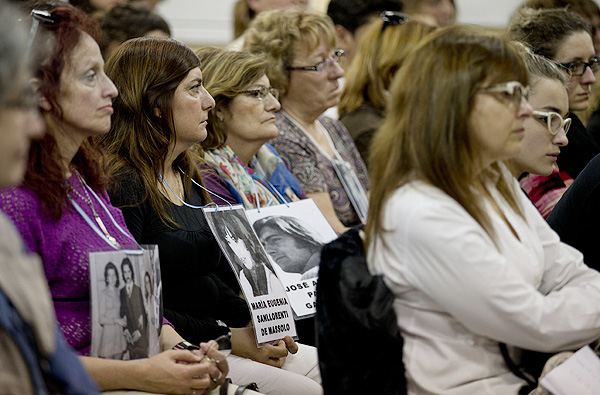 Women holding photos of disappeared relatives, Argentina