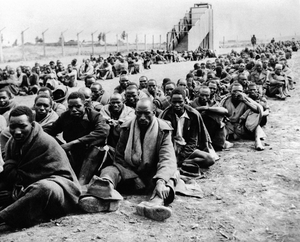 Some of the 150,000 Kikuyu people who were forced into detention camps in the Mau Mau rebellion, 1952. 