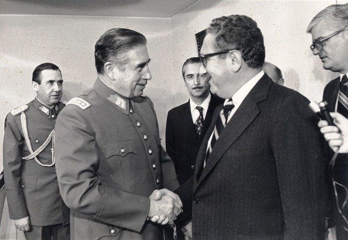 U.S. Secretary of State Henry Kissinger visits with Chilean dictator General Augusto Pinochet in 1976.