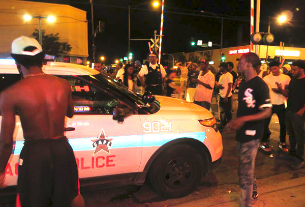 Blocking a pig car, Chicago, August 5