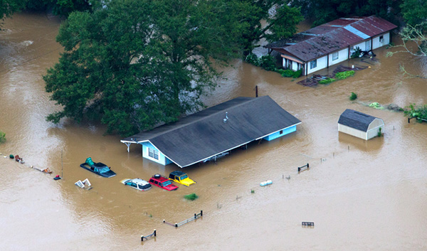 People being rescued from flooded homes along the Tangipahoa River near Amite, La., August 13. 