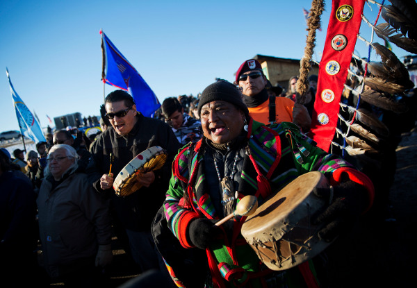 Procession through the Oceti Sakowin camp after it was announced that the U.S. Army Corps of Engineers won't grant easement for the Dakota Access oil pipeline, December 4, 2016. (AP photo)