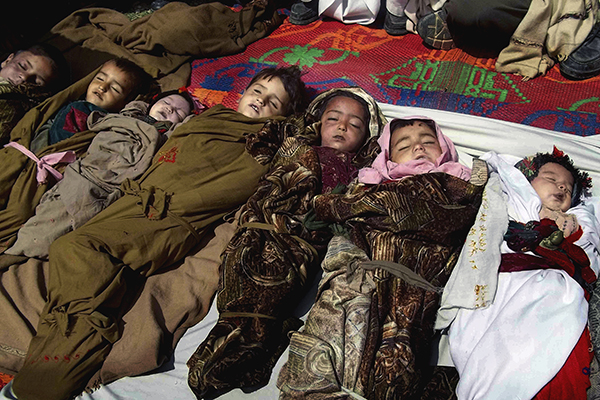 The bodies of Afghan children who were killed by a U.S.-led NATO airstrike which killed several Afghan civilians, including ten children April 2013.  (Photo:AP)