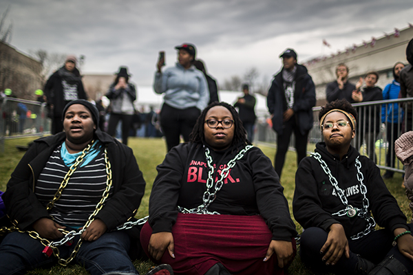 People from Black Lives Matter chain themselves to protest Donald Trump, Washington, DC, January 20. 