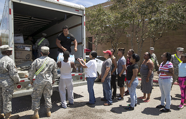 People from Beaumont, TX line up for water.