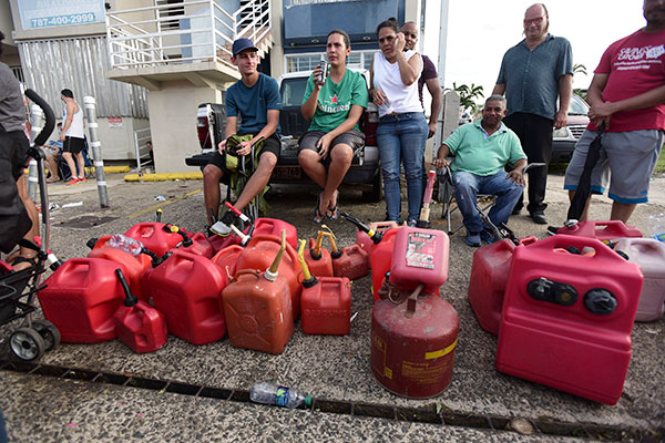 People in Puerto Rico wait in line for gas