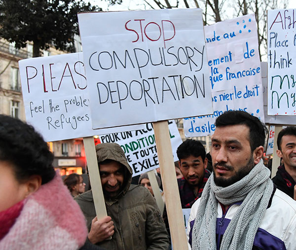 People in Paris protest immigration laws, February 2018. Photo: AP