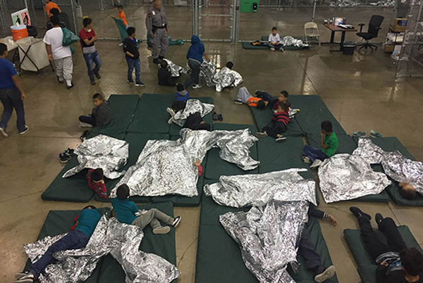 children separated at border with foil blankets